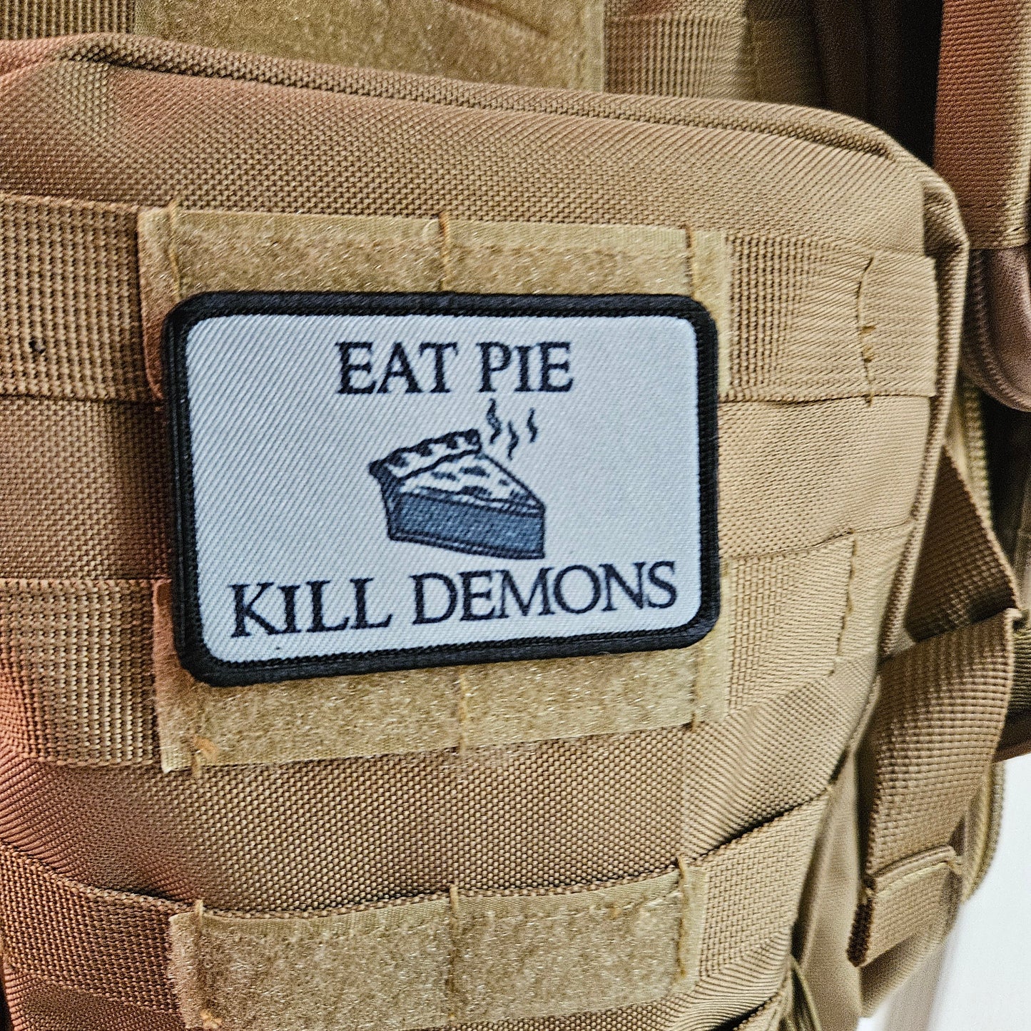 Eat pie kill demons funny meme  2"x3" removable morale patch with hook and loop backing