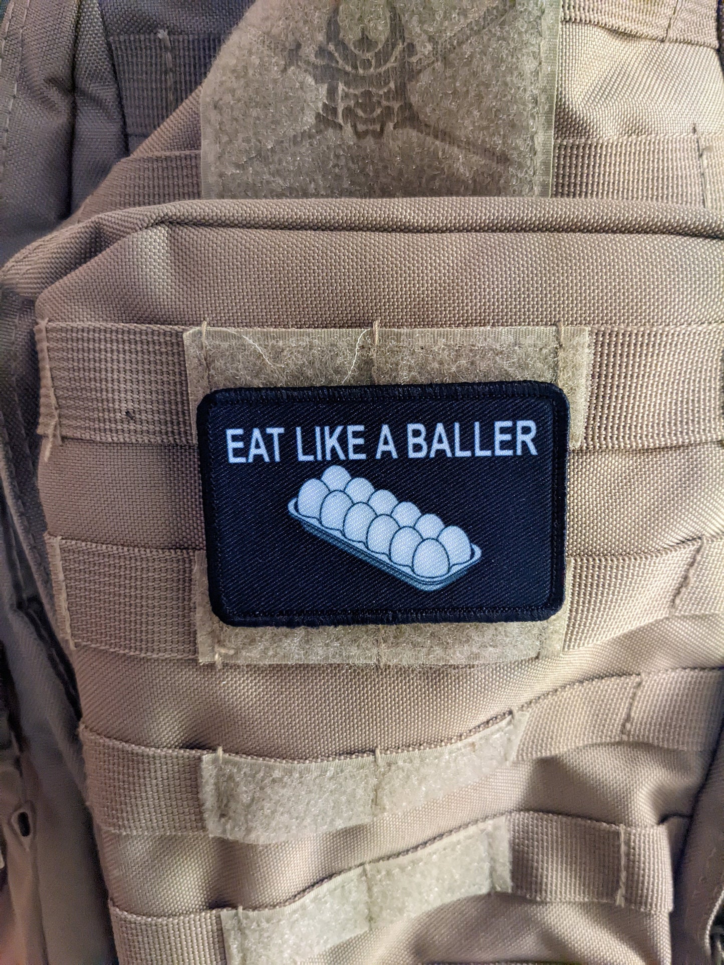 Eat like a baller egg shortage inflation meme  2"x3" removable morale patch with hook and loop backing