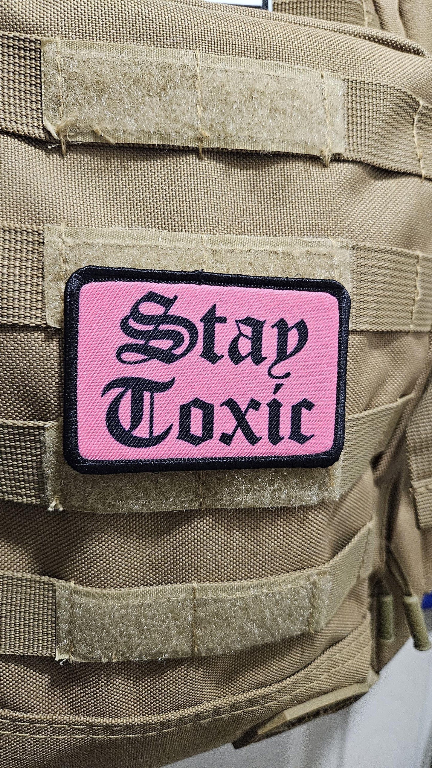 Stay toxic meme  black on pink 2"x3" removable morale patch with hook and loop backing