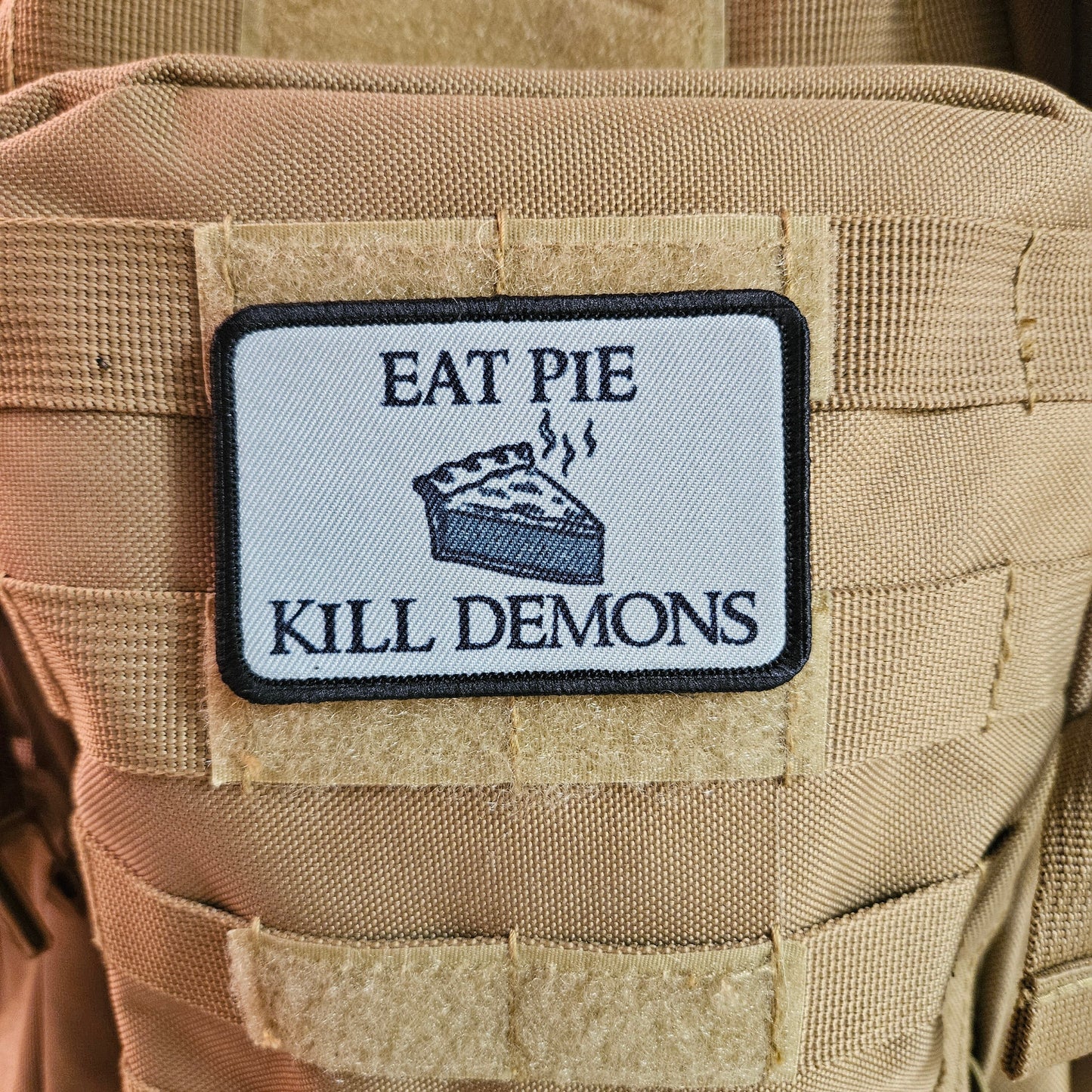 Eat pie kill demons funny meme  2"x3" removable morale patch with hook and loop backing