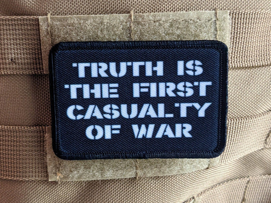 Truth is the first casualty of war 2"x3" morale patch with hook and loop backing