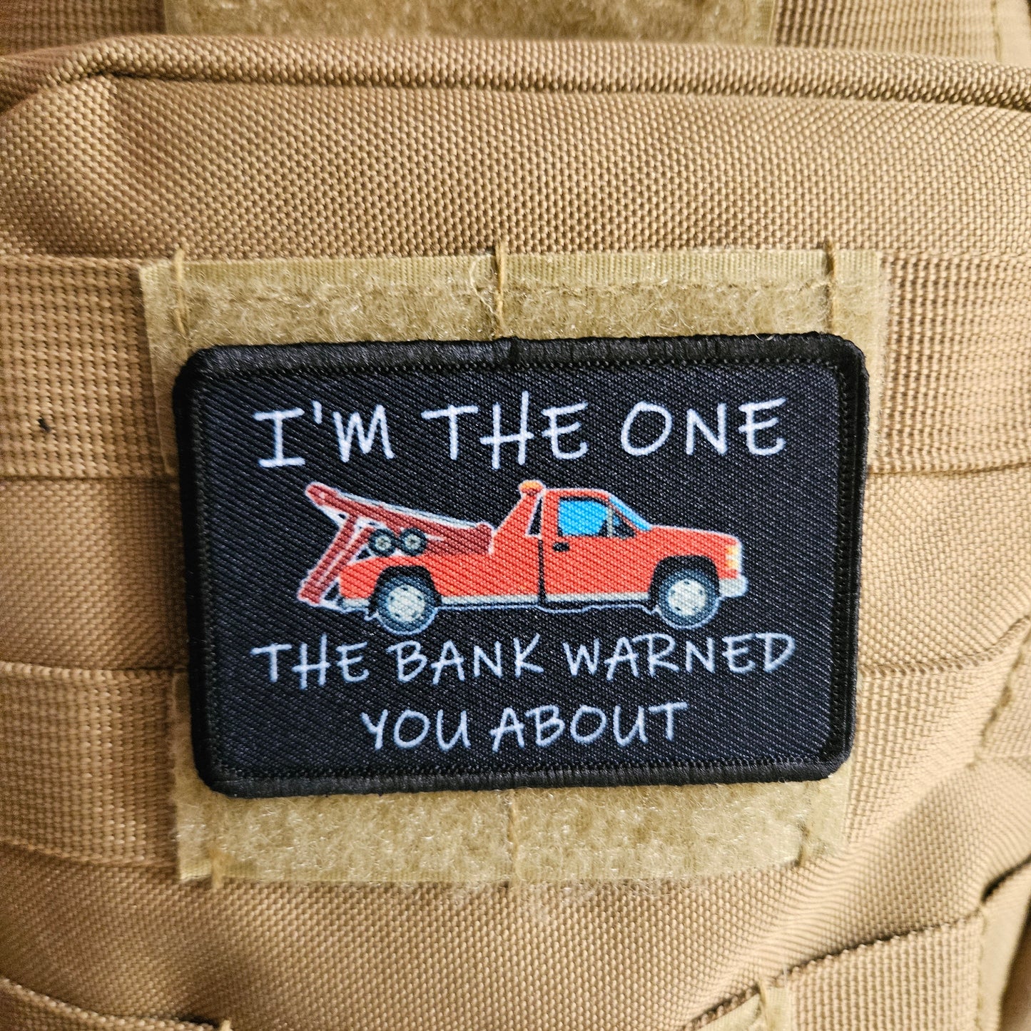 I'm the one the bank warned you about tow truck repo funny 2"x3" removable morale patch with hook and loop backing