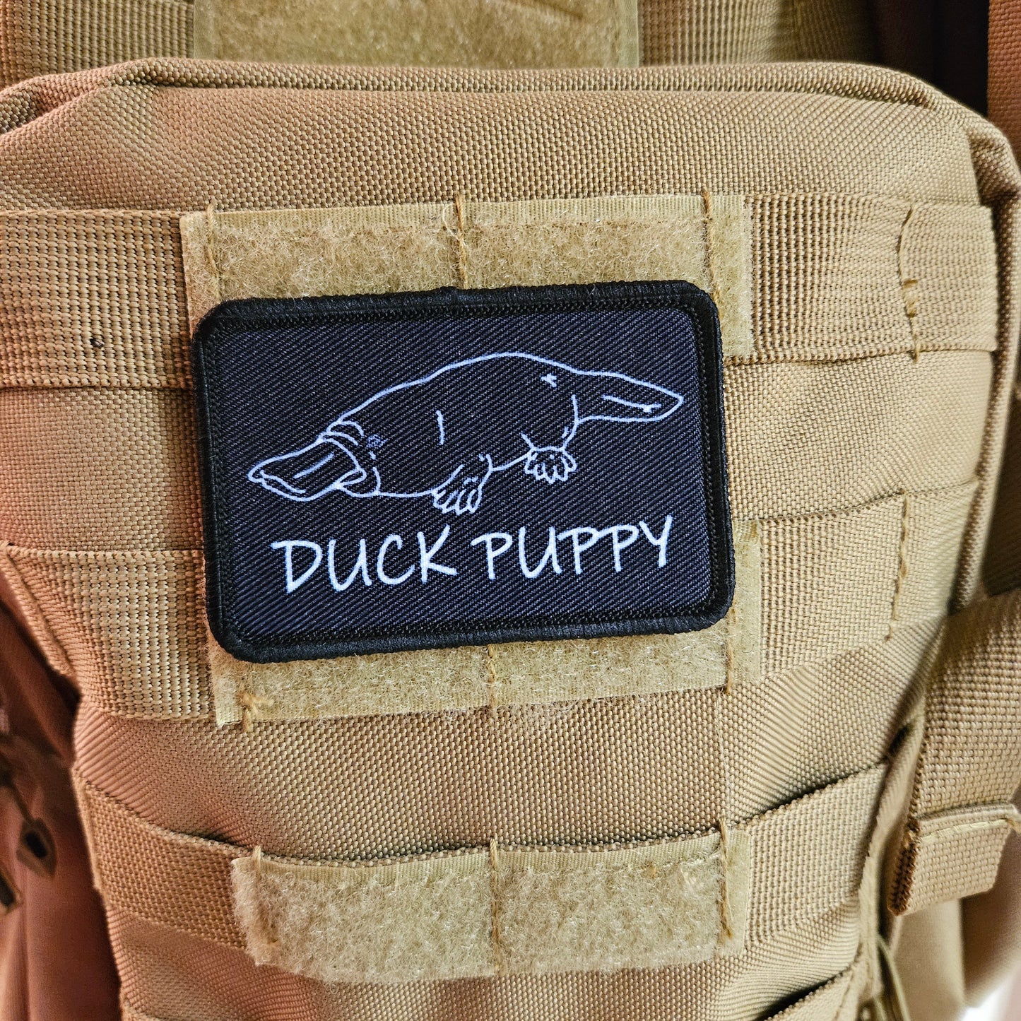 Duck puppy duck billed platypus black meme funny  2"x3" morale patch with hook and loop backing