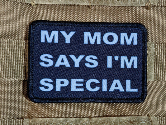 my mom says i'm special funny 2"x3" morale patch with hook and loop backing green background