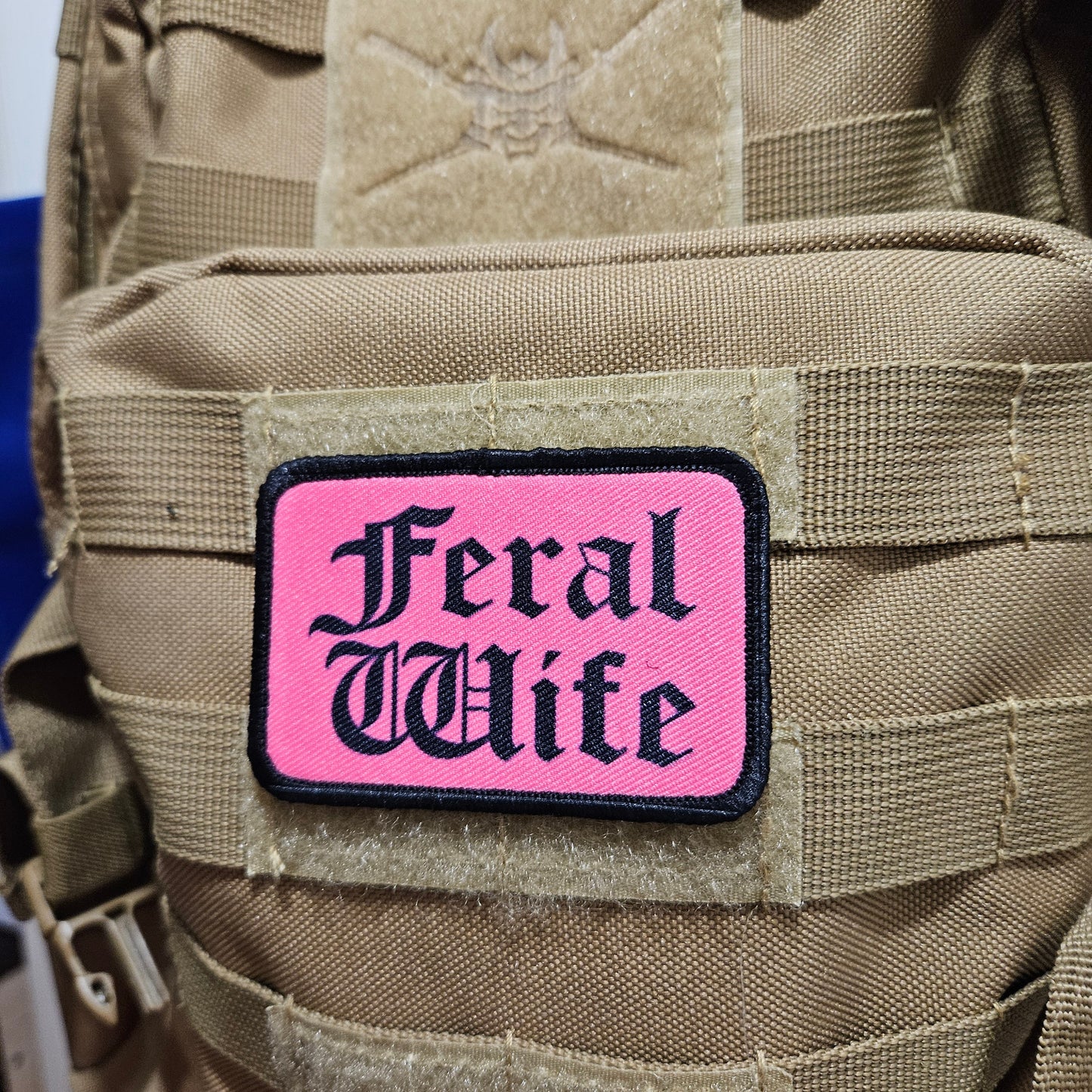 Feral wife meme 2"x3" morale patch with hook and loop backing black on pink