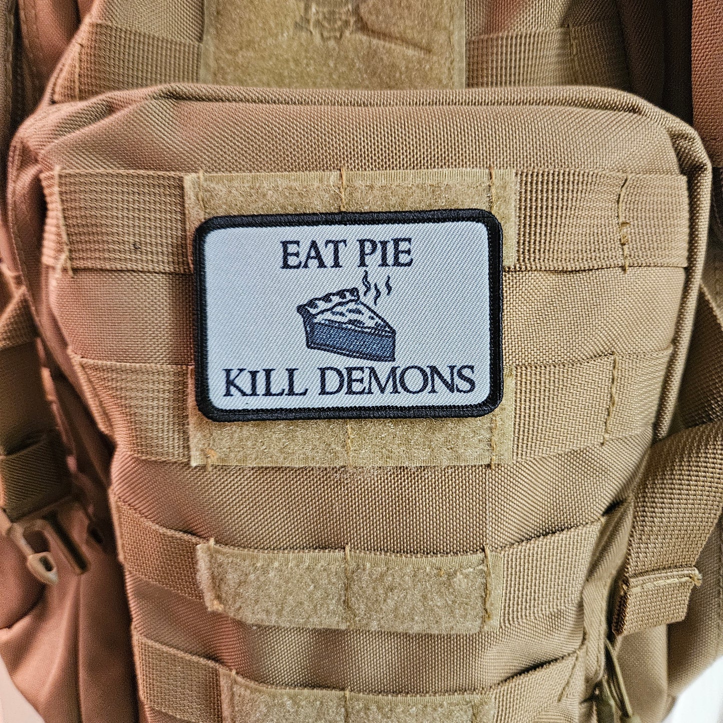 Eat pie kill demons funny meme  2"x3" removable morale patch with hook and loop backing