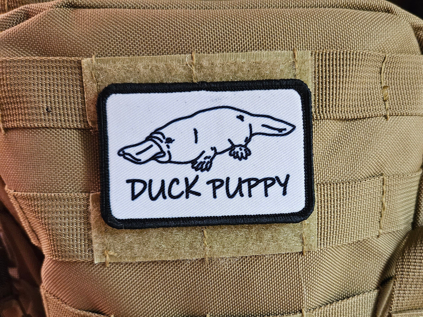 Duck puppy duck billed platypus white meme funny  2"x3" morale patch with hook and loop backing