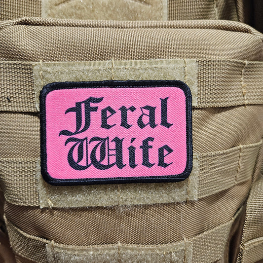 Feral wife meme 2"x3" morale patch with hook and loop backing black on pink