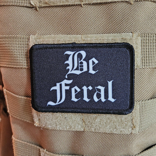 Black and white "be feral" girls and boys meme 2"x3" morale patch with hook and loop backing