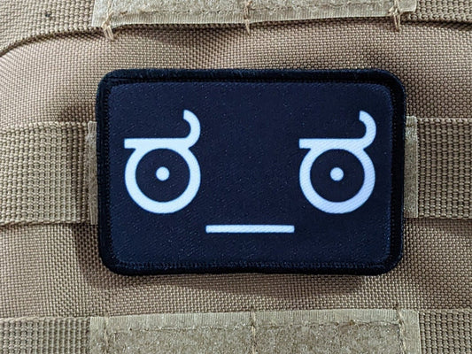 Lenny face of disapproval face black background meme 2"x3" morale patch with hook and loop backing