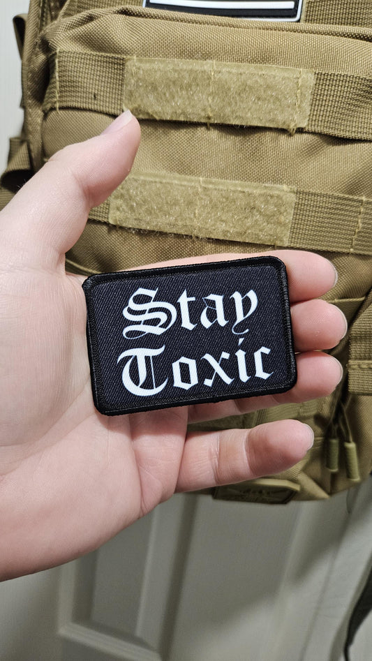 Stay toxic meme  white on black 2"x3" removable morale patch with hook and loop backing