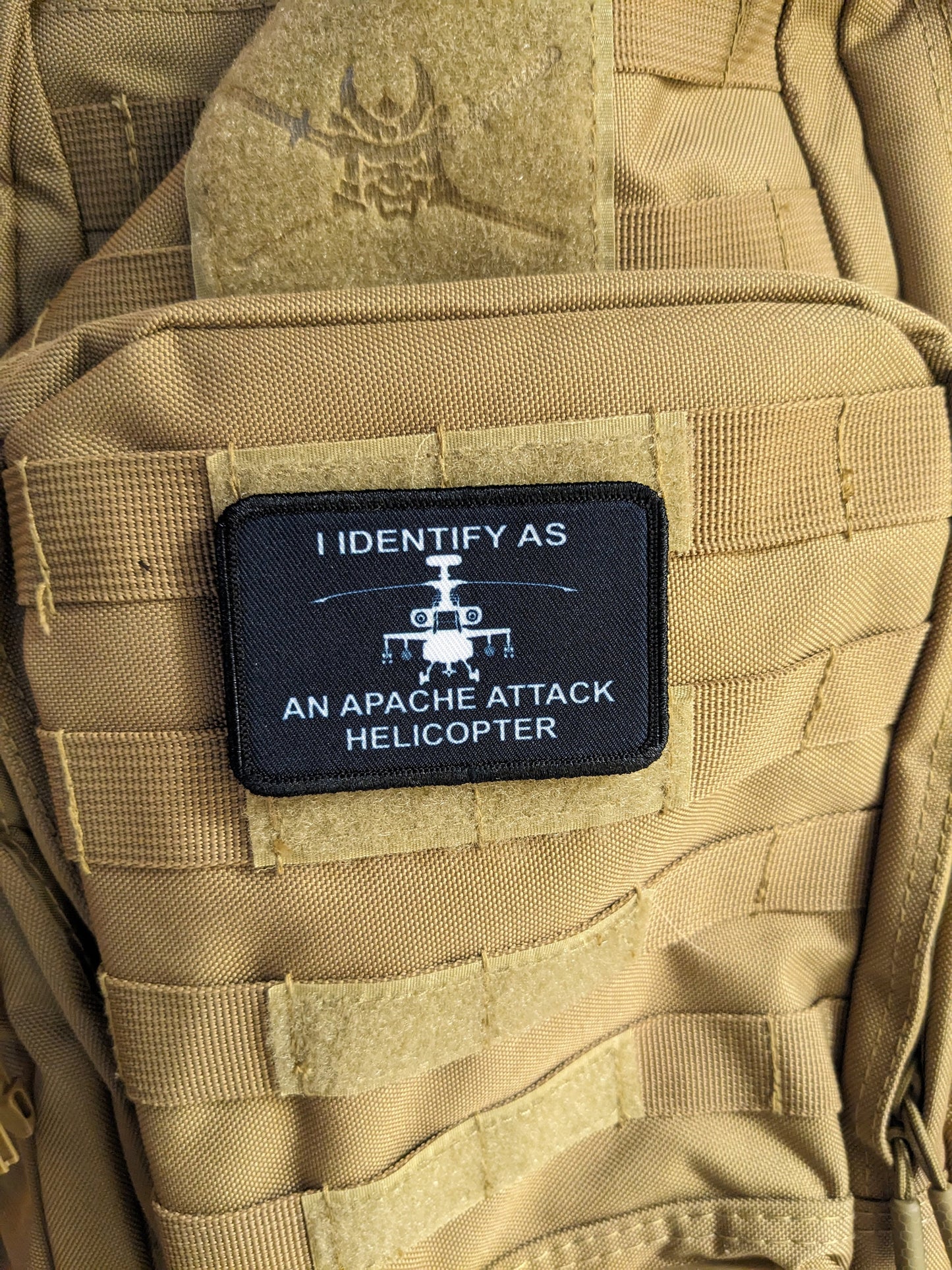 I identify as an Apache attack helicopter 2"x3" morale patch with hook and loop backing