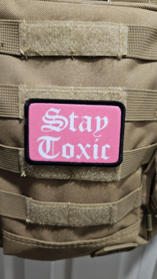 Stay toxic meme  pink and white 2"x3" removable morale patch with hook and loop backing