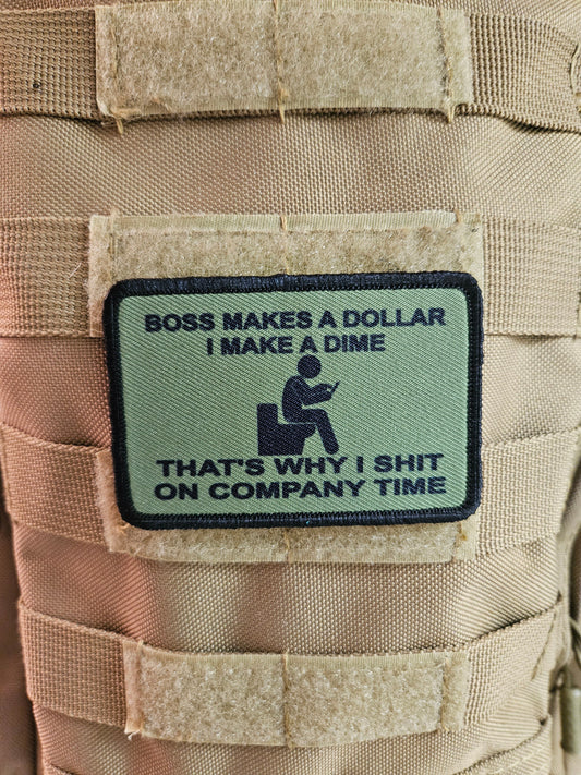 Boss makes a dollar I make a dime that's why I shit on company time 2"x3" morale patch with hook and loop backing green