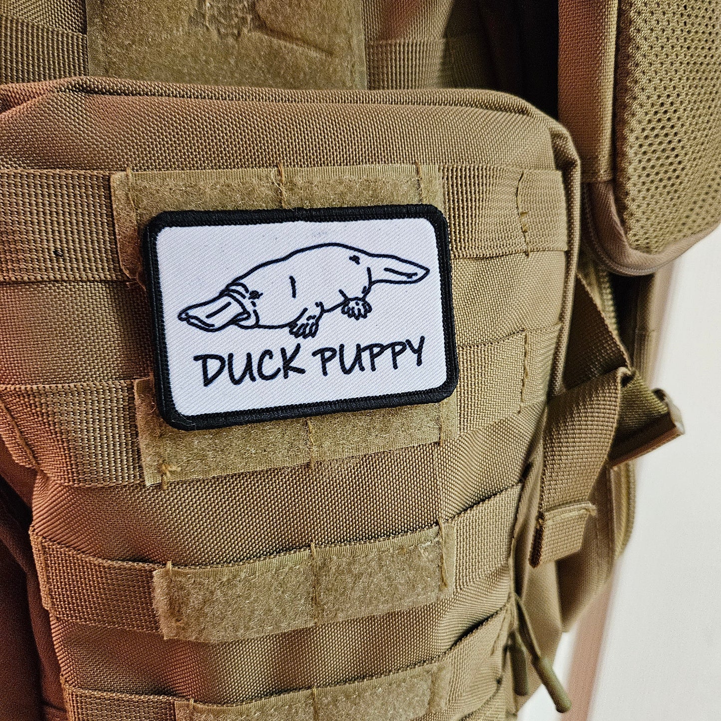 Duck puppy duck billed platypus white meme funny  2"x3" morale patch with hook and loop backing